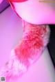 A close up of a pink fur collar on a mannequin.
